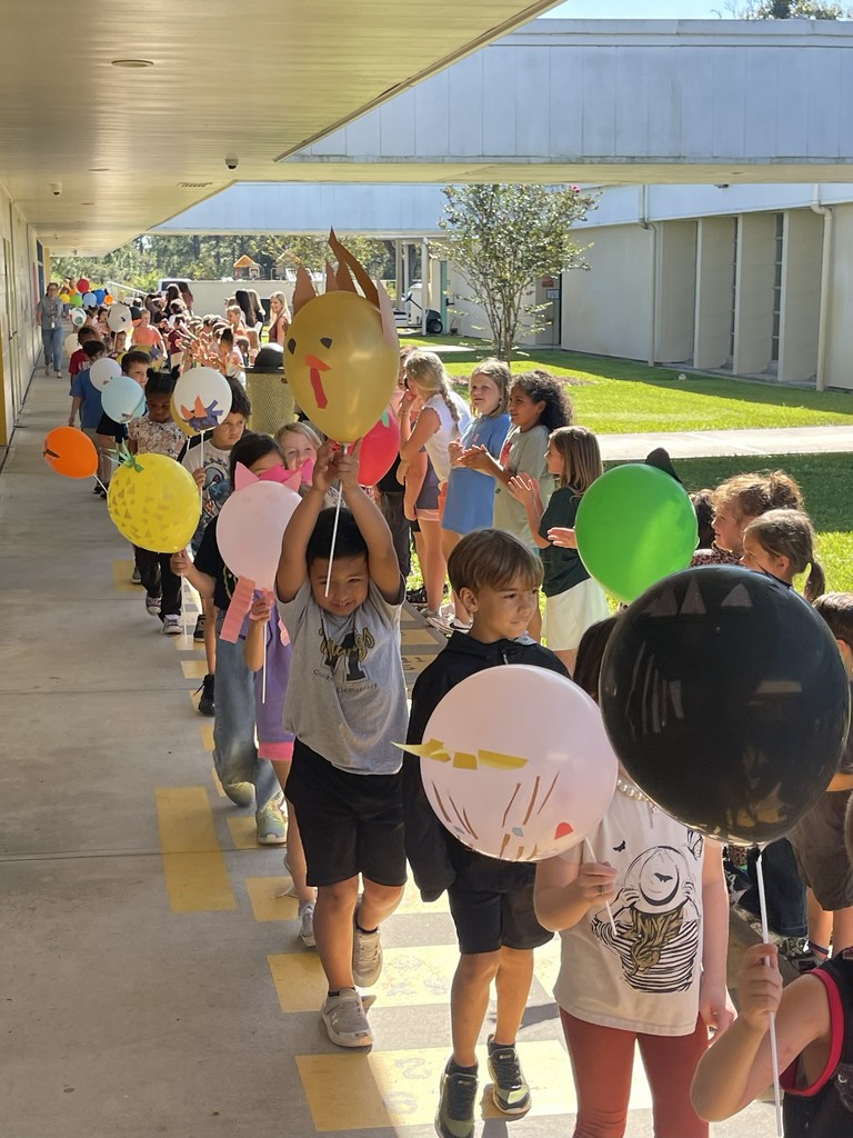 Students celebrating Thanksgiving Parade.