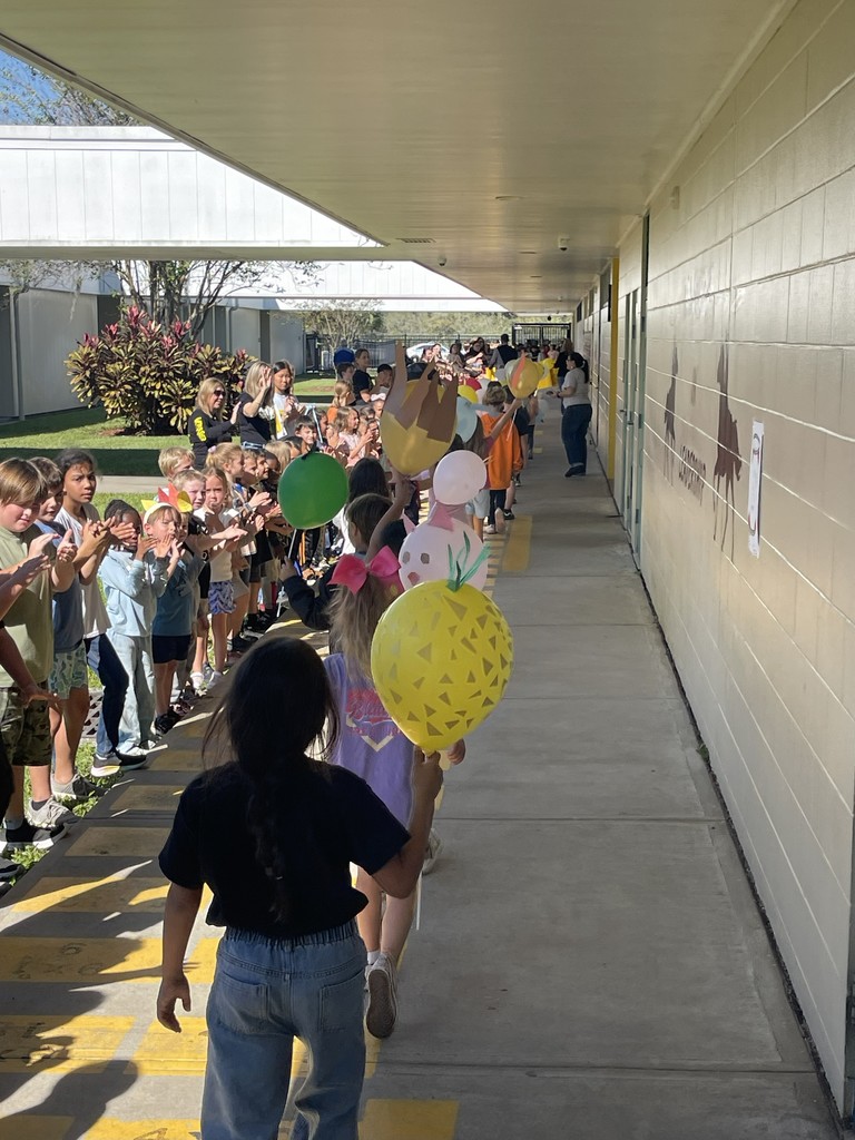 Students celebrating Thanksgiving Parade.