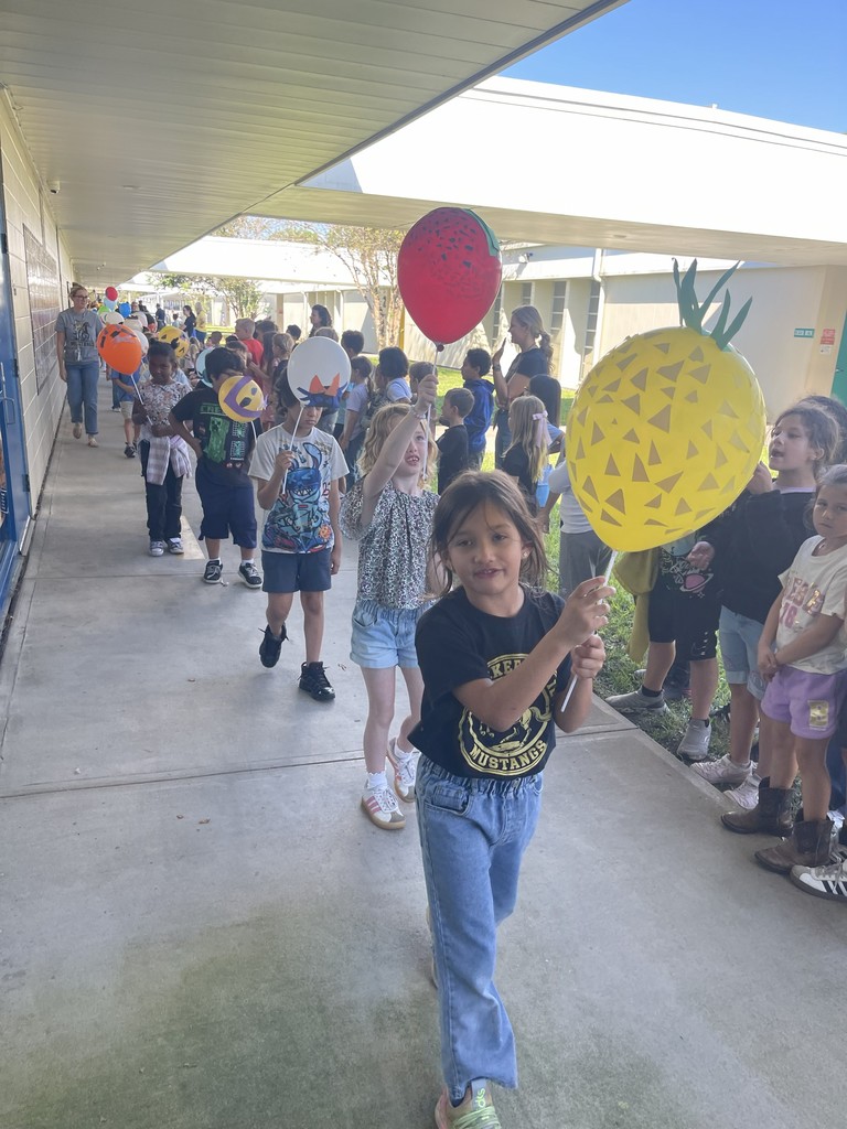 Students celebrating Thanksgiving Parade.