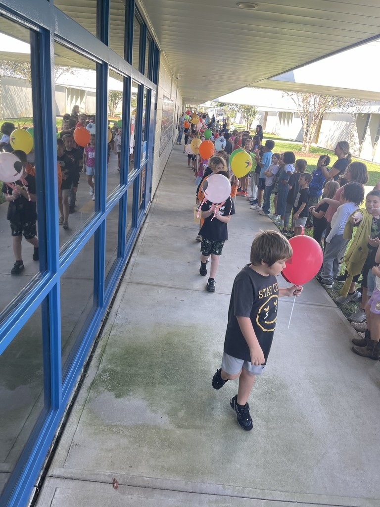 Students celebrating Thanksgiving Parade.