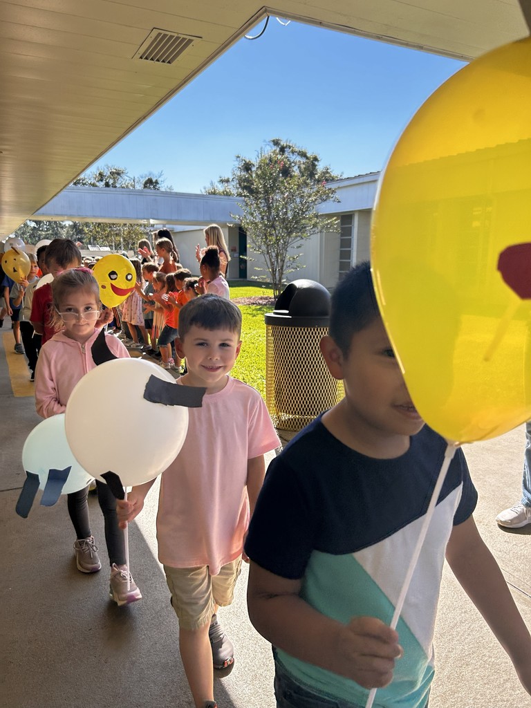 Students celebrating Thanksgiving Parade.