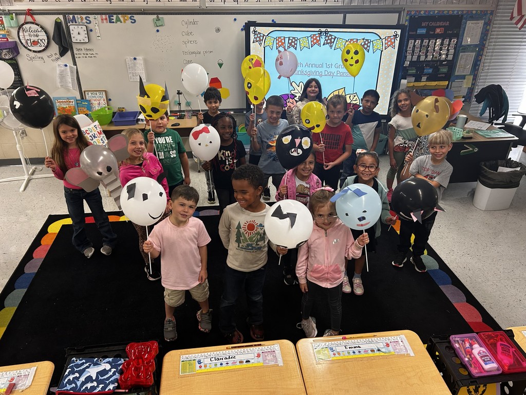 Class celebrating Thanksgiving Parade.