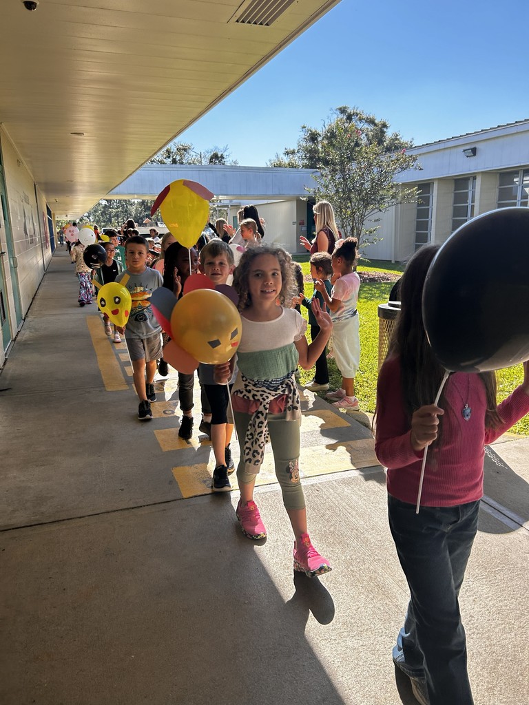 Students celebrating Thanksgiving Parade.