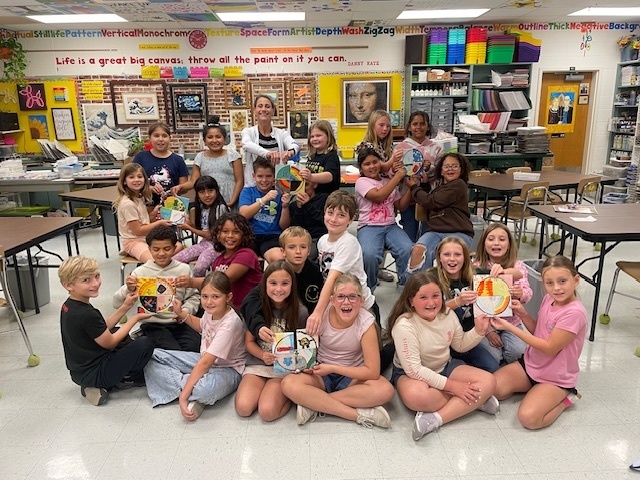 Mrs. Rowe's 4th Grade class display their tiles.