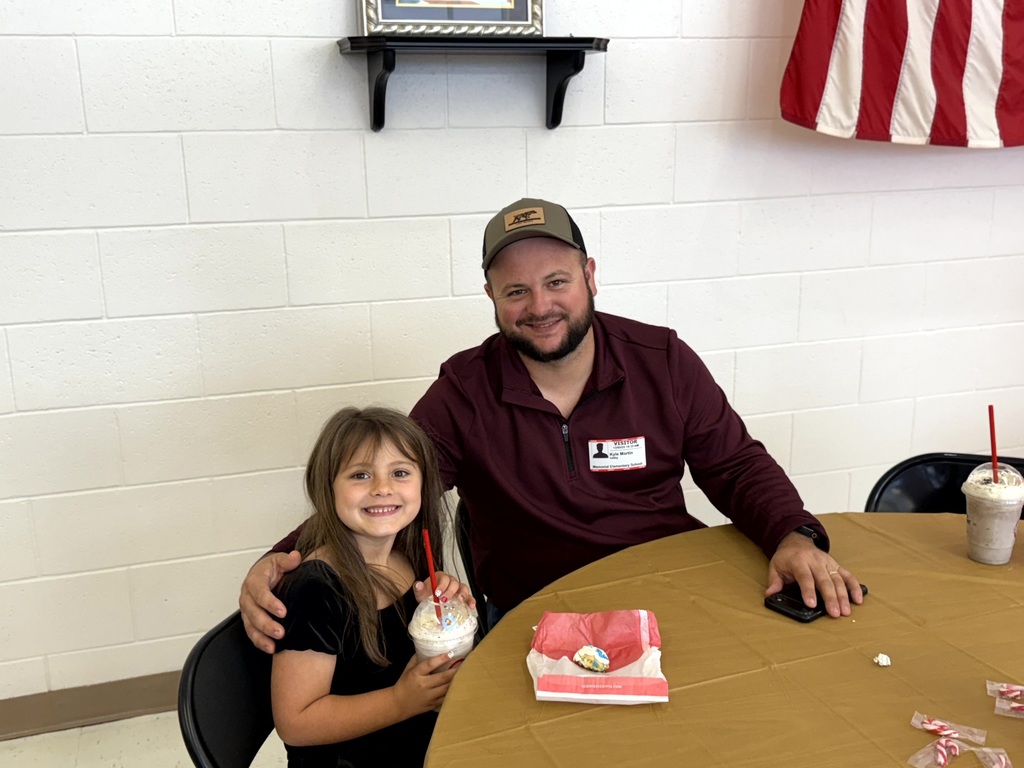 MES Parents enjoying Christmas lunch with their student.