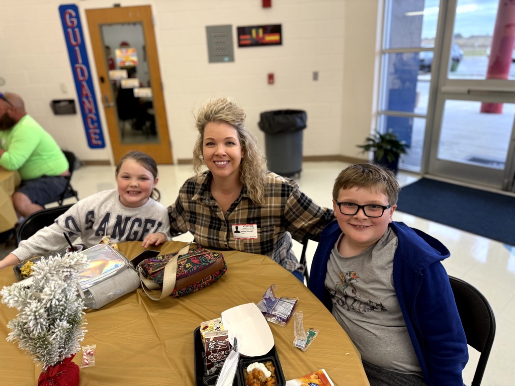 MES Parents enjoying Christmas lunch with their student.