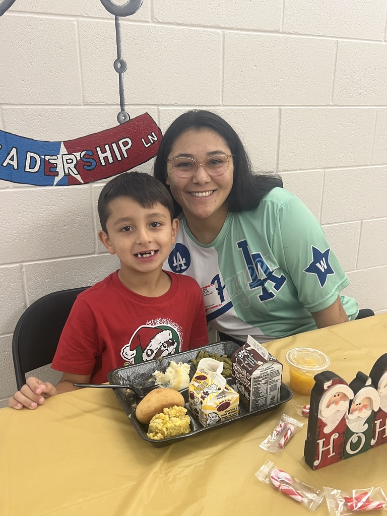 MES Parents enjoying Christmas lunch with their student.