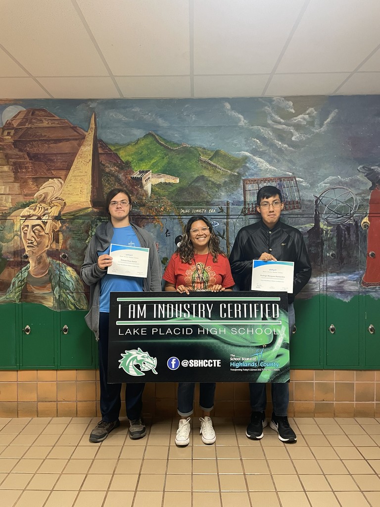 Students holding certificates.
