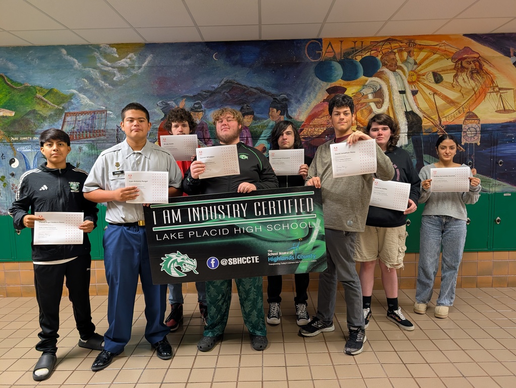 Students holding certificate.