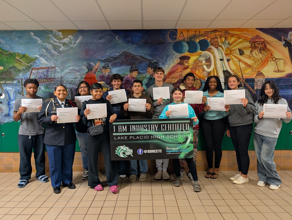 Students holding certificate.
