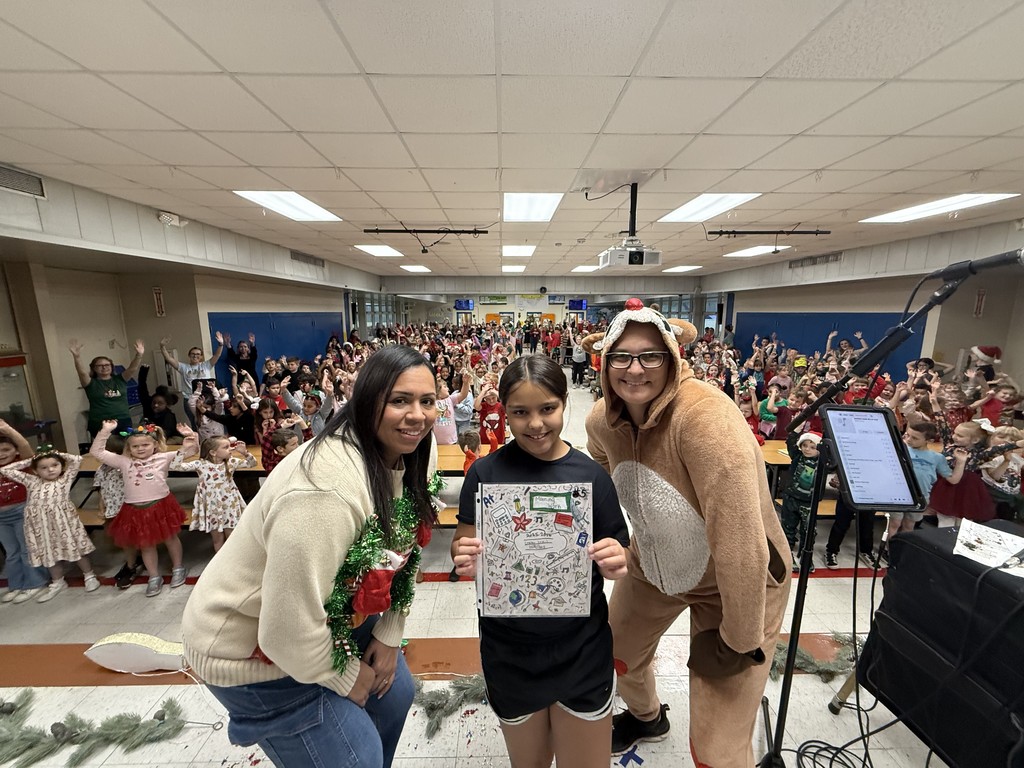 Teachers with yearbook cover contest winner.