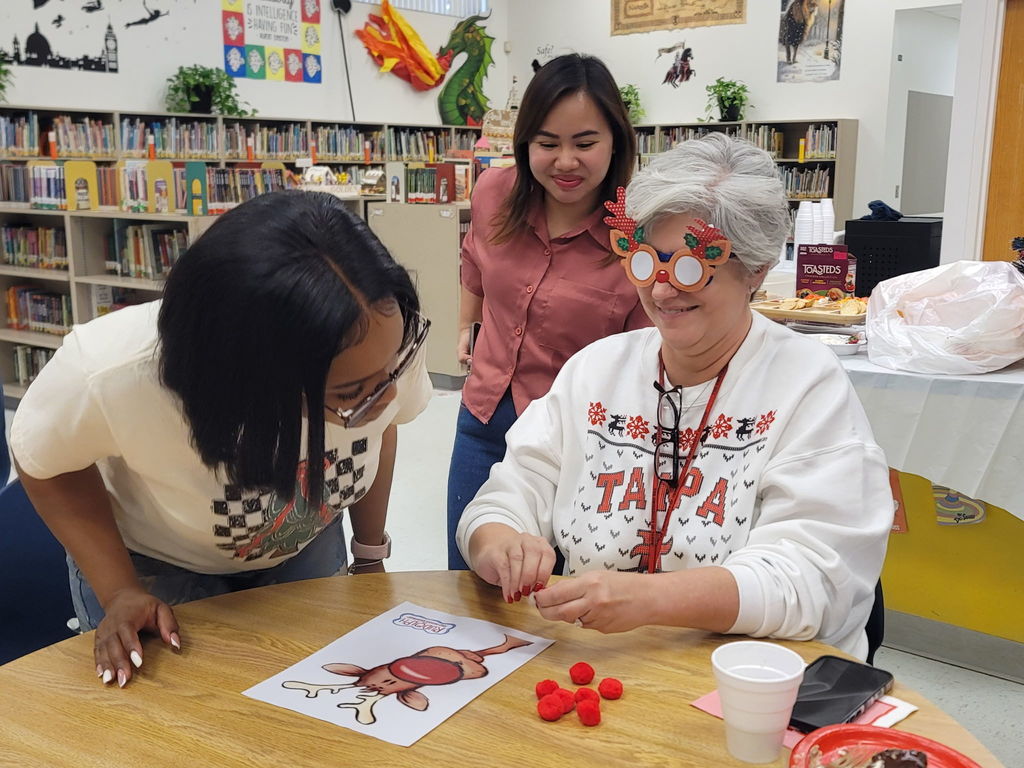 AES Staff having a nice time at the Staff Christmas party.