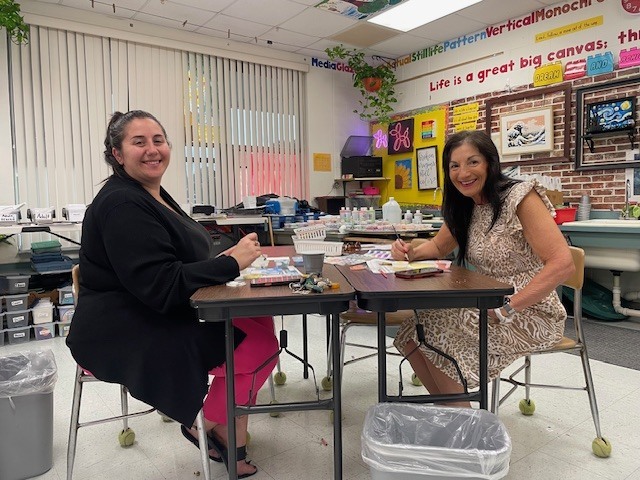 Alexis and Vicki working on their tiles.