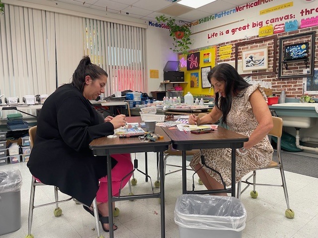 Alexis and Vicki working on their tiles.