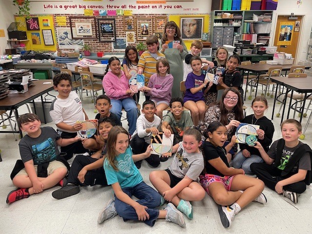 Class displays their completed tiles.