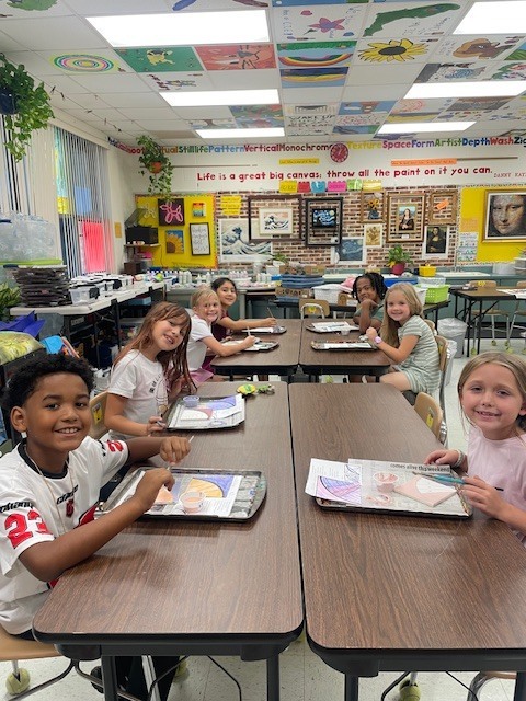 Mrs. Carter's class working on tiles for the tile wall.