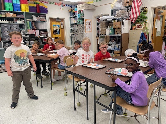 Mrs. Carter's class working on tiles for the tile wall.