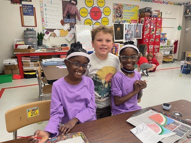 Mrs. Carter's class working on tiles for the tile wall.