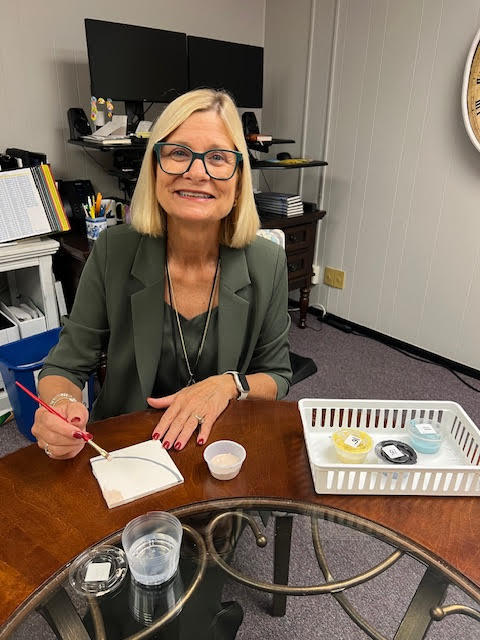 Superintendent painting tile