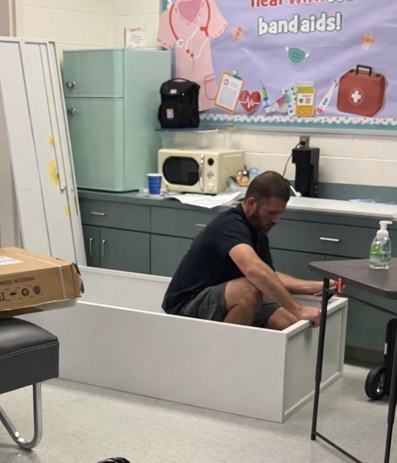 Volunteer building cabinets.