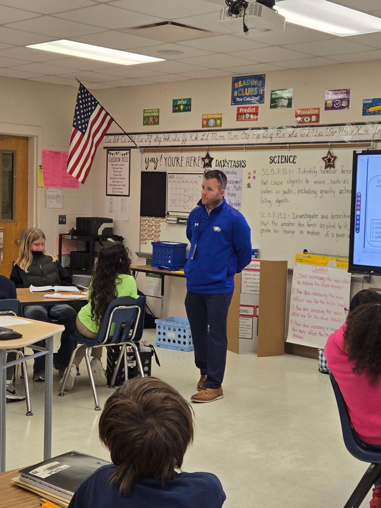 Mr. Ward from HGMS talking with MES 5th graders in the classrooms.