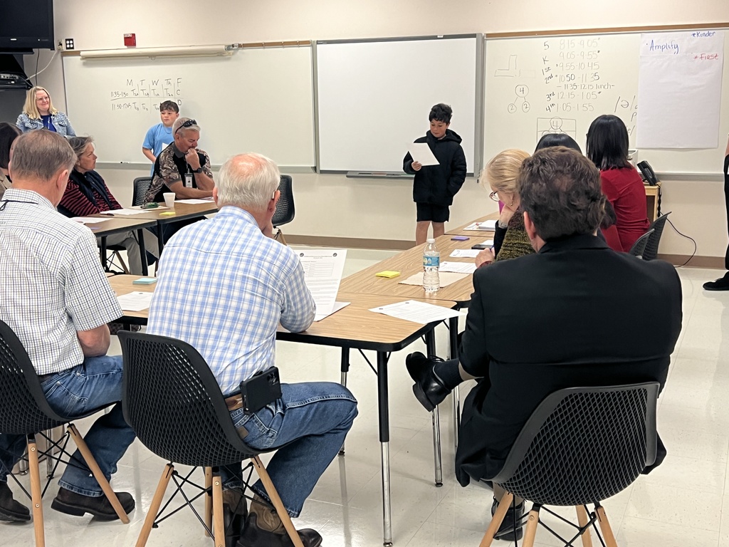 Students speaking to school board members and district staff about the projects at MES