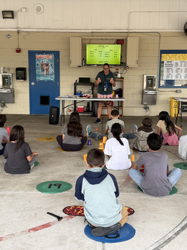 Coach explaining stacking cups