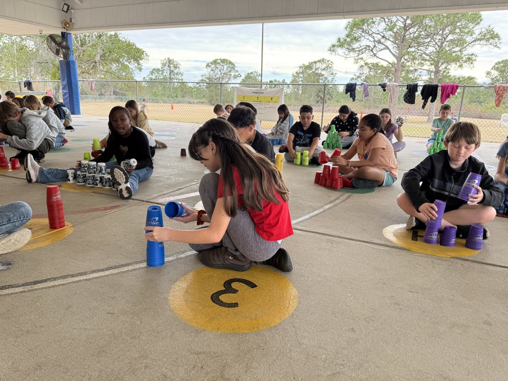 Students stacking cups