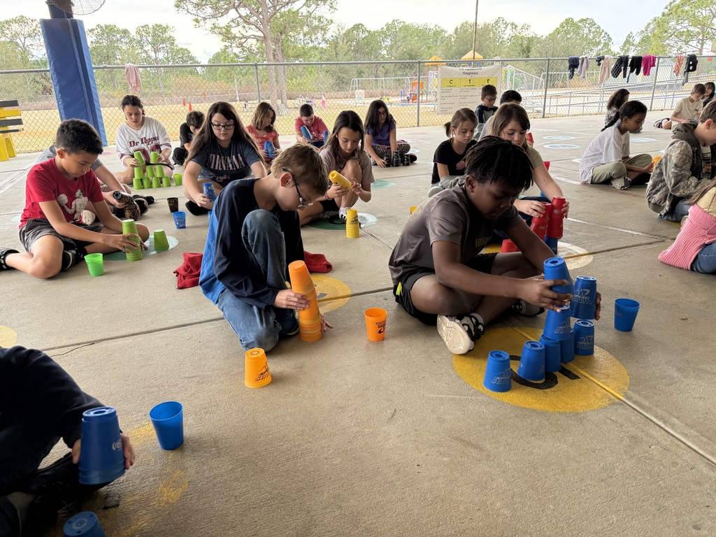 Students stacking cups