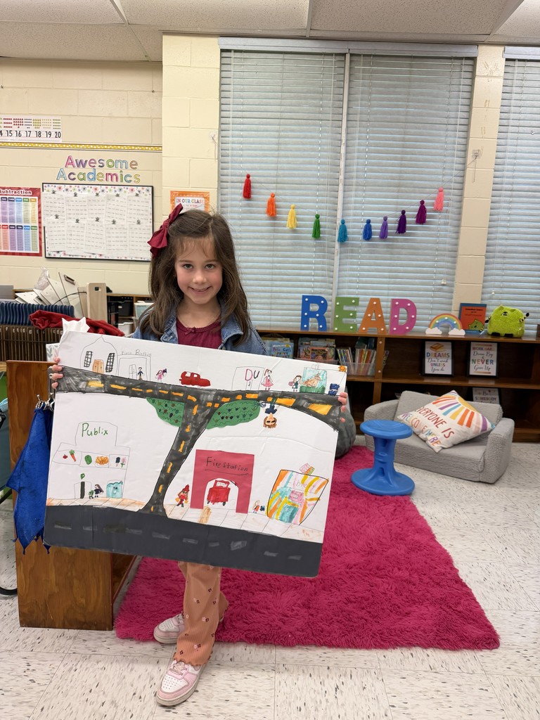 Students displaying their community projects.