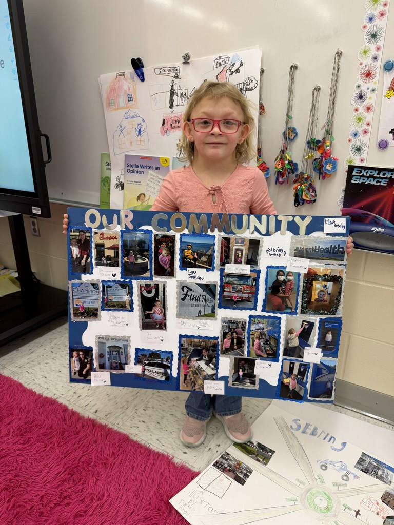 Students displaying their community projects.