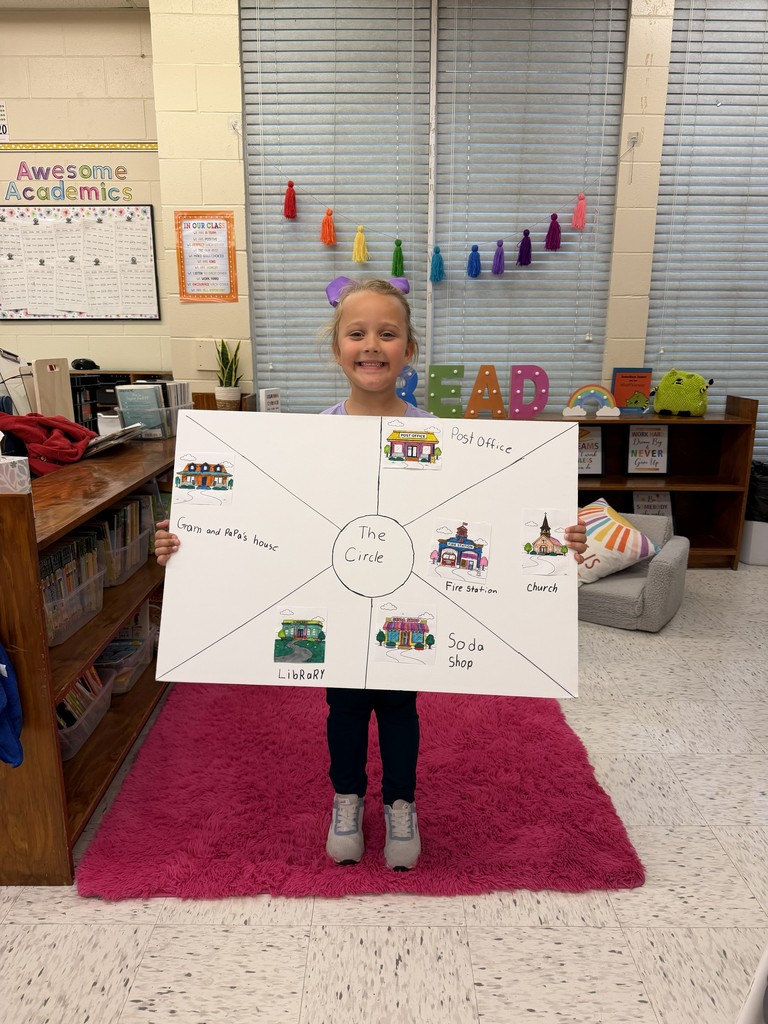 Students displaying their community projects.