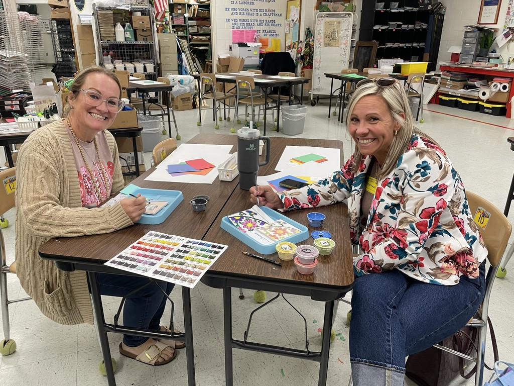 Sisters painting tiles
