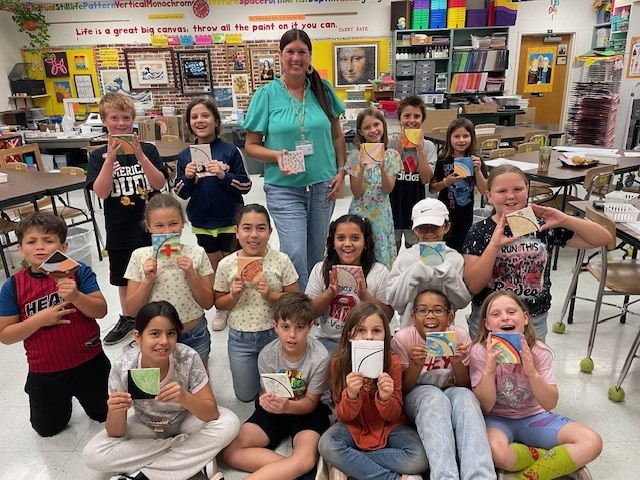 Mrs. Chovance's class with their completed tiles.