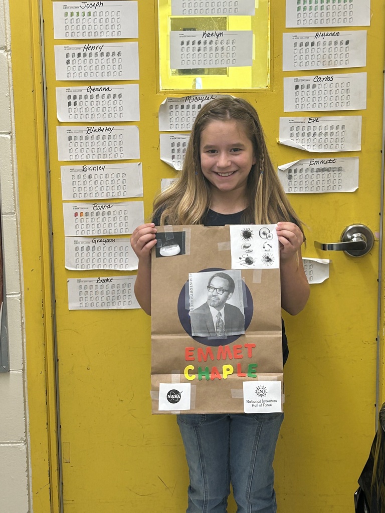 Female student standing with his Black History Month project.