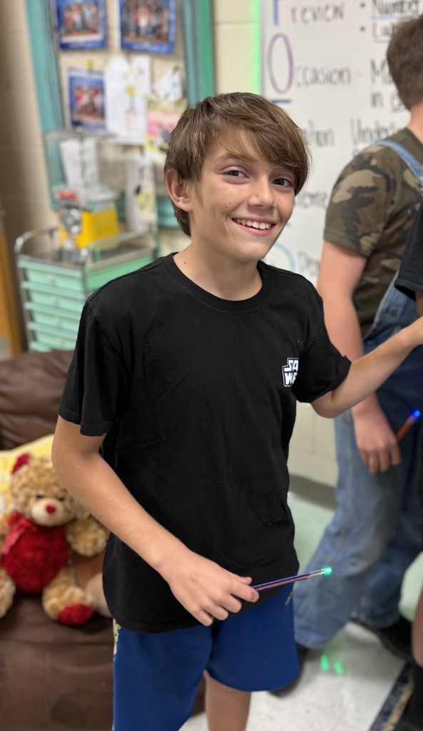 During science block, Mrs. Cook’s 5th graders spent time investigating and illustrating how electricity flows through a closed circuit (a complete loop) by creating their own popsicle stick flashlights!