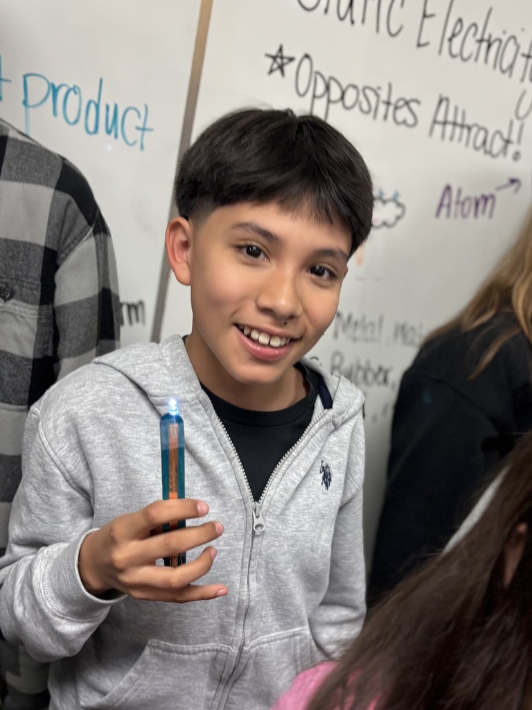 During science block, Mrs. Cook’s 5th graders spent time investigating and illustrating how electricity flows through a closed circuit (a complete loop) by creating their own popsicle stick flashlights!