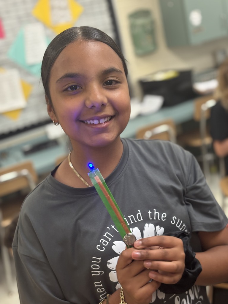 During science block, Mrs. Cook’s 5th graders spent time investigating and illustrating how electricity flows through a closed circuit (a complete loop) by creating their own popsicle stick flashlights!