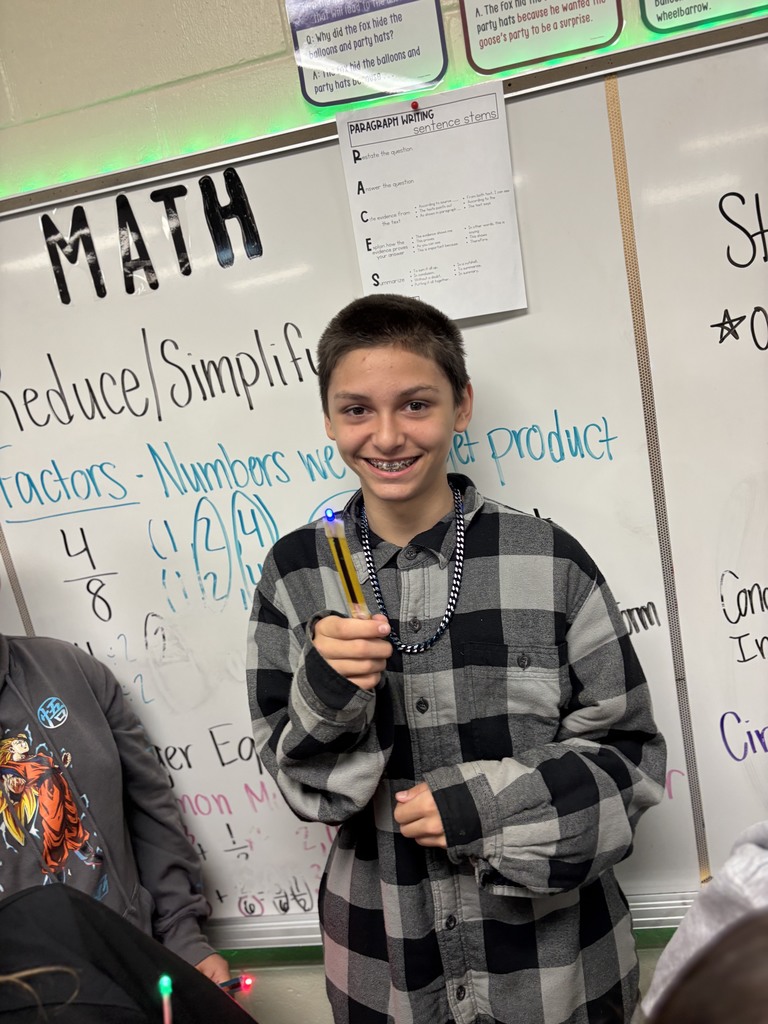 During science block, Mrs. Cook’s 5th graders spent time investigating and illustrating how electricity flows through a closed circuit (a complete loop) by creating their own popsicle stick flashlights!