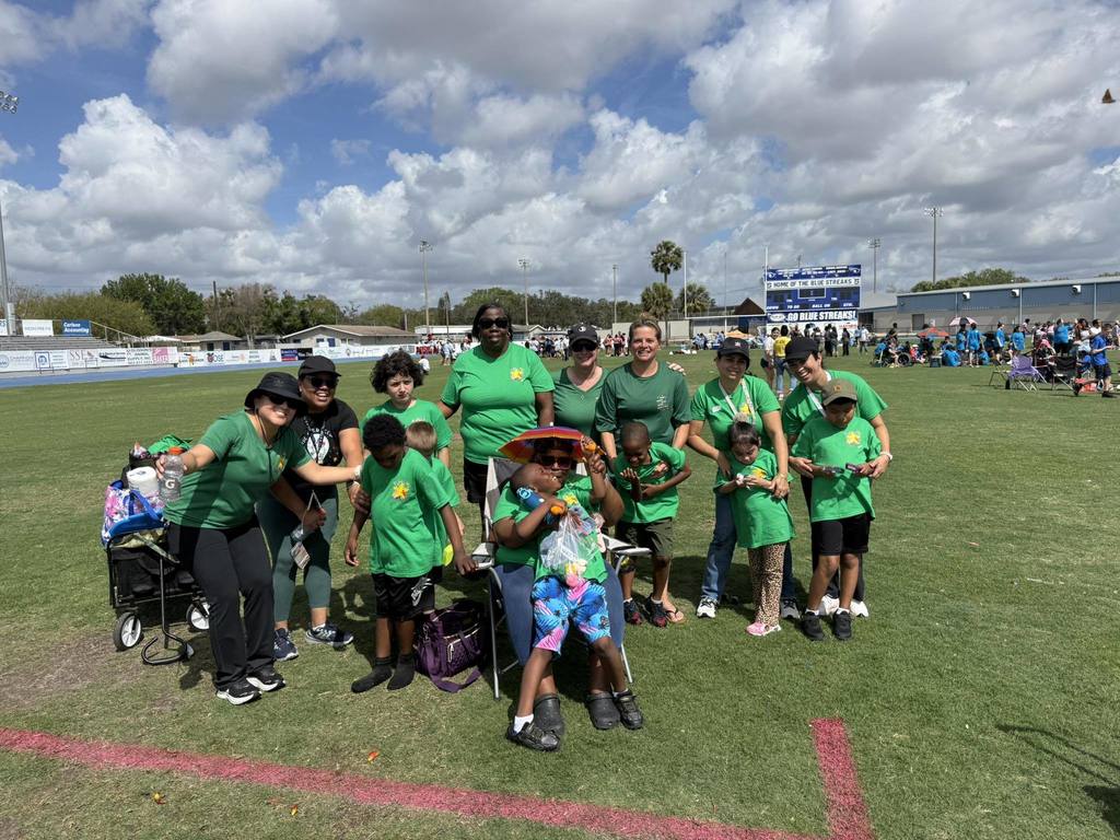 LPE Special Star students posing with their teachers and paras after a long day of fun on the field!