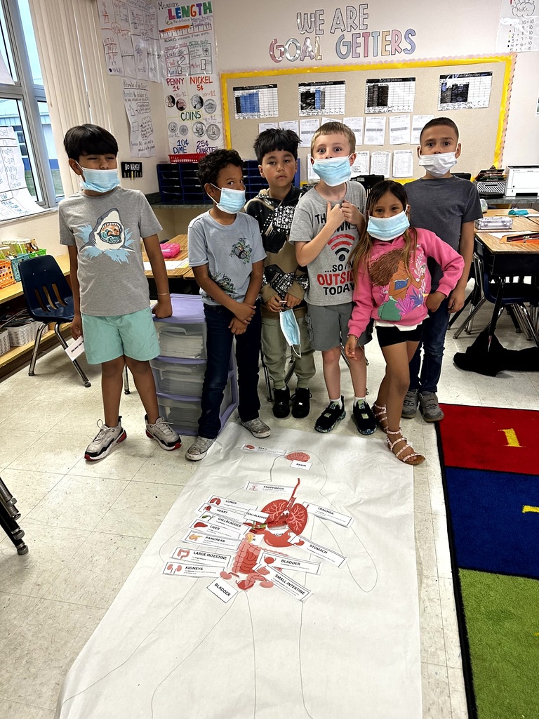 2nd grade students and staff end of unit learning activity on Human Body.