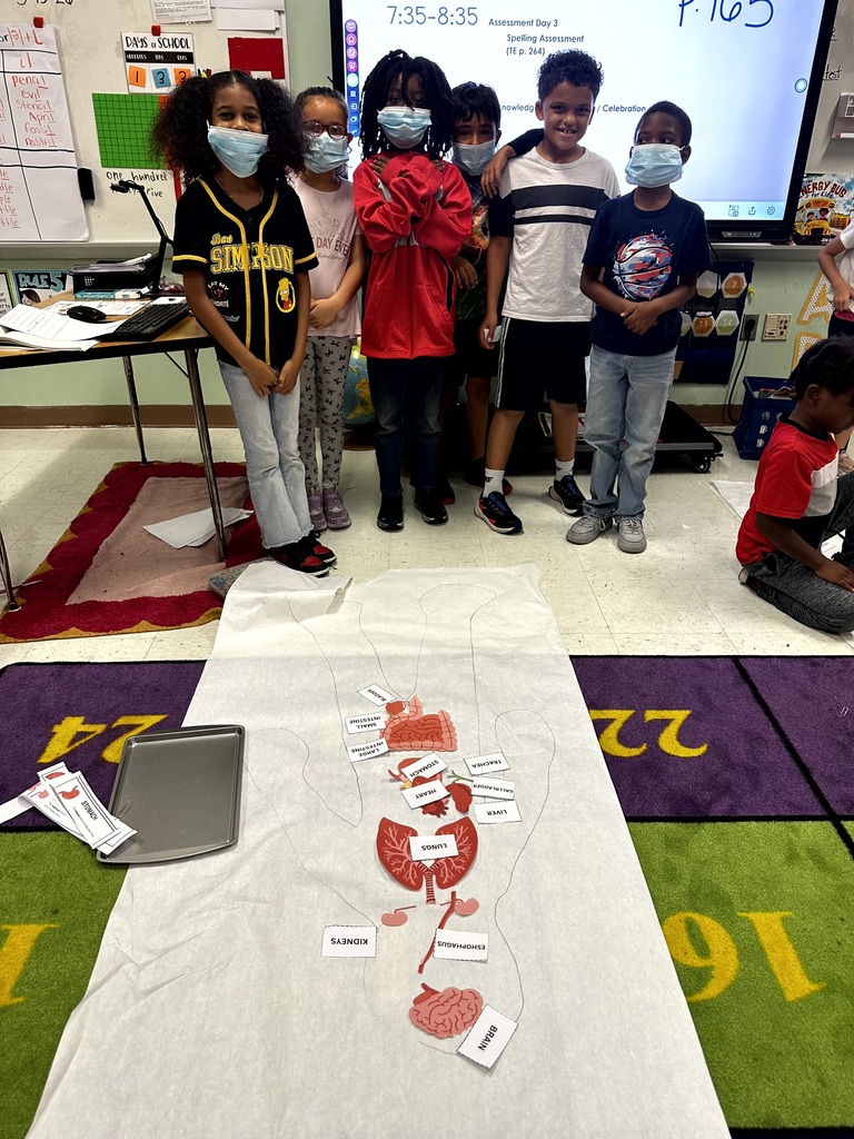 2nd grade students and staff end of unit learning activity on Human Body.