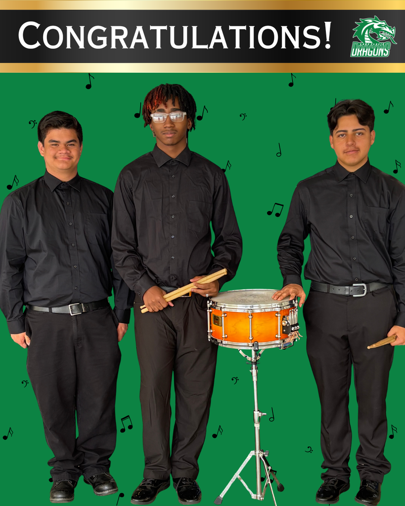 Three students with drum an d congratulations banner. 