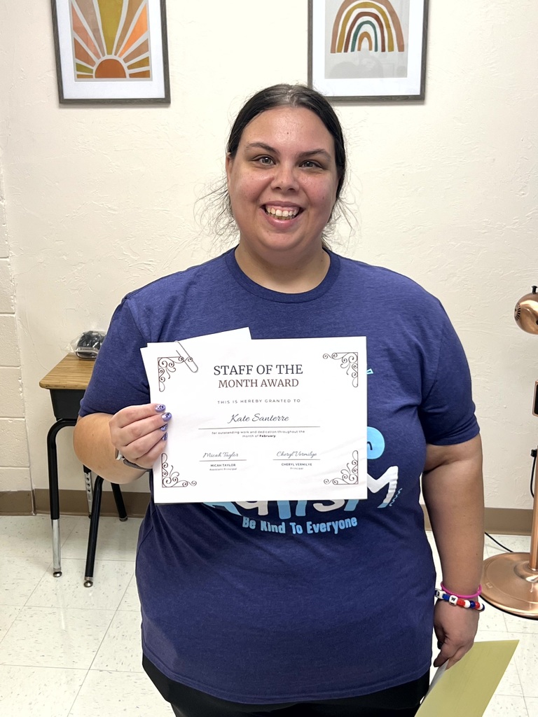 Miss Santere pictured holding her certificate.