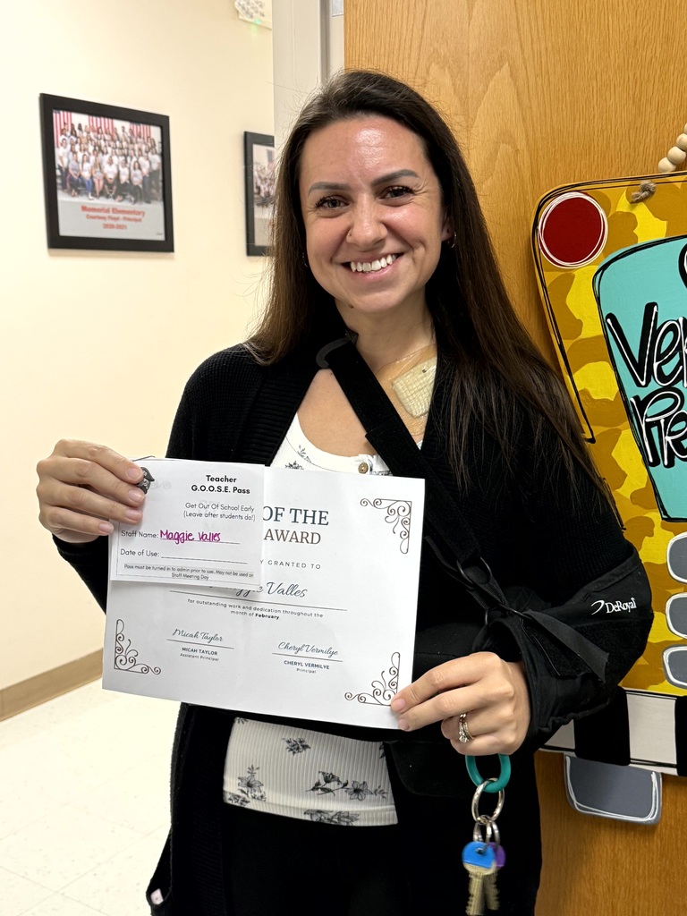 Mrs. Valles pictured holding her certificate.