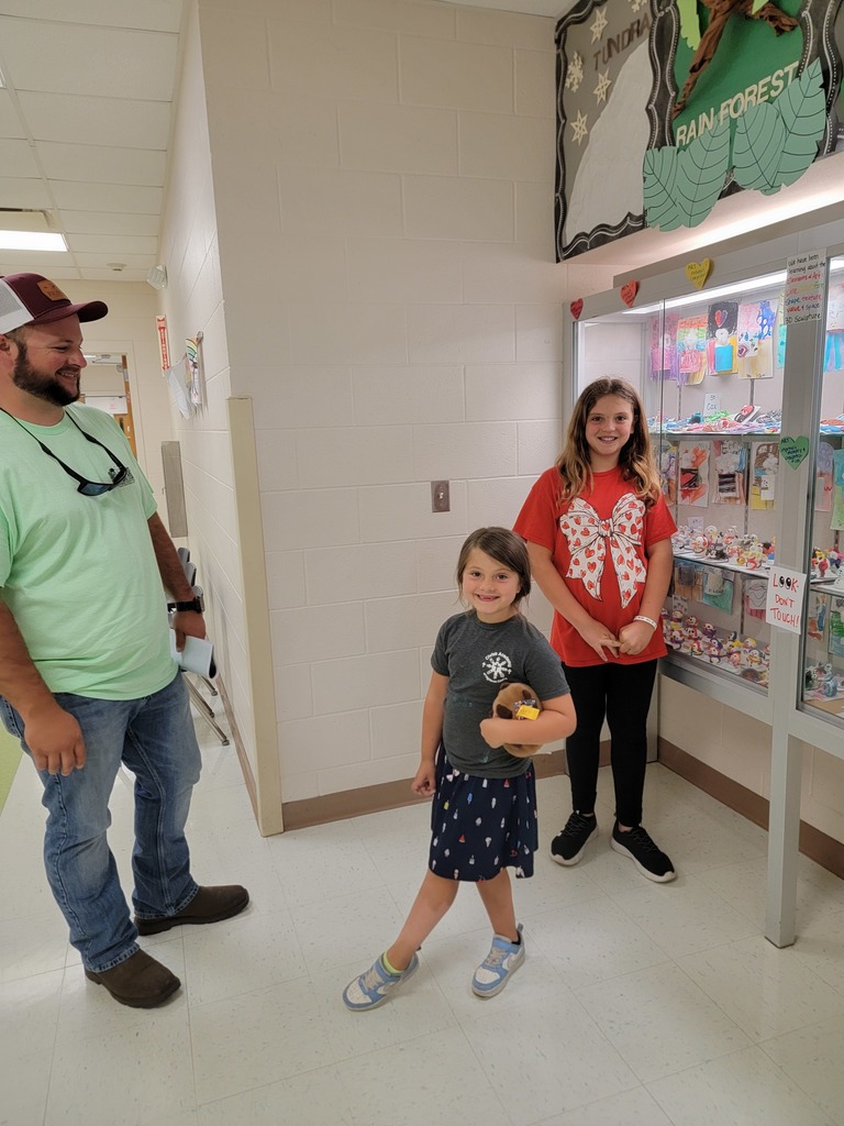 MES students and families look at the Art Work displays.