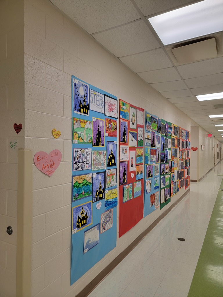 MES students art work displayed on walls and in cabinets.