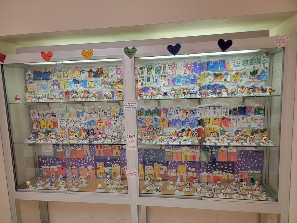 MES students art work displayed on walls and in cabinets.