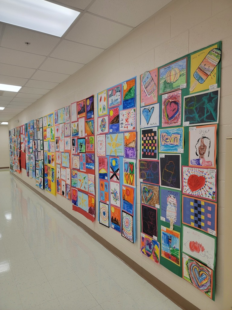 MES students art work displayed on walls and in cabinets.