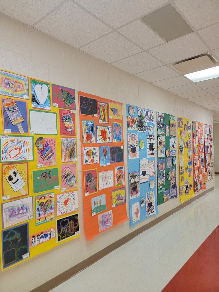 MES students art work displayed on walls and in cabinets.